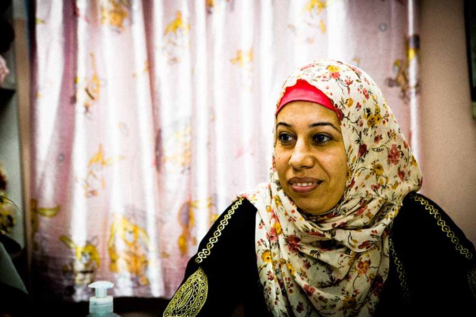 A woman from Gaza wearing a colourful head scarf.