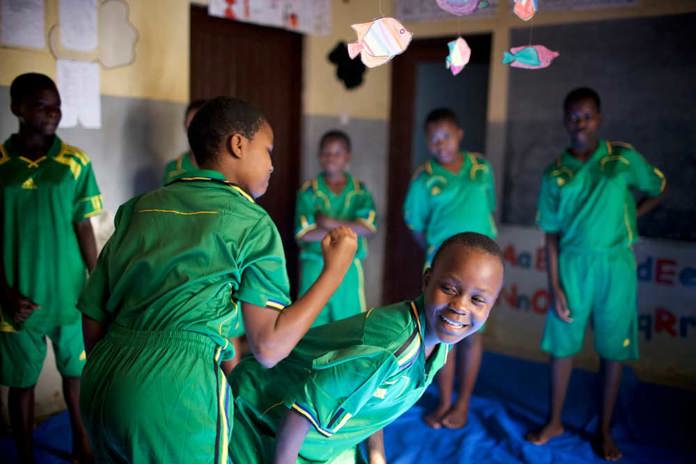 Young women from Cheka Sana in Tanzania practising self defence.