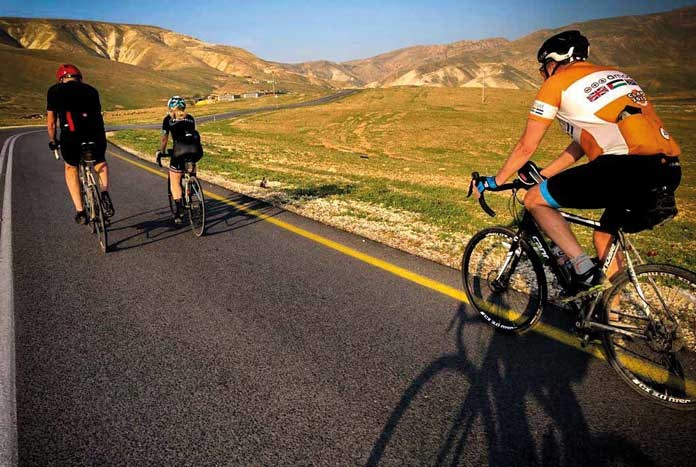 Members of Team Amos cycling through the West Bank on their way to Jericho.