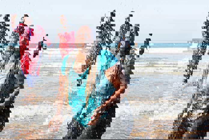 Woman from around the world enjoying time in the sea in North Devon.