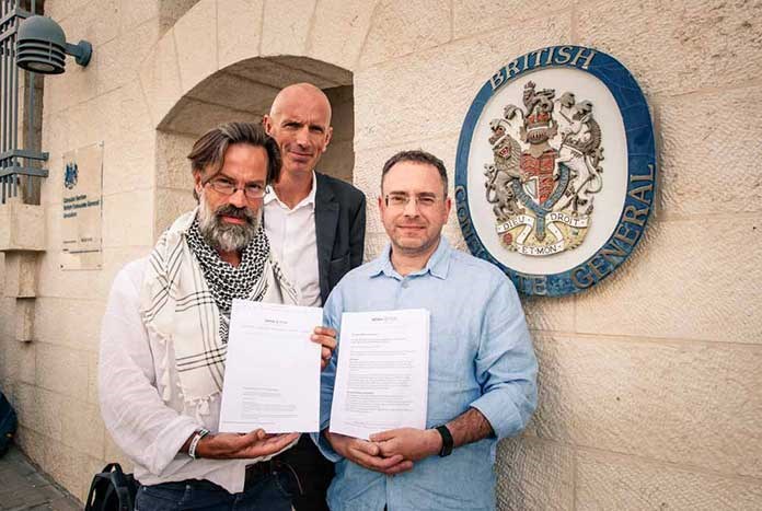 Justin Butcher, Chris Rose and Robert Cohen outside the British Consulate in Jerusalem in 2017 as part of Amos Trust's Just Walk to Jerusalem.
