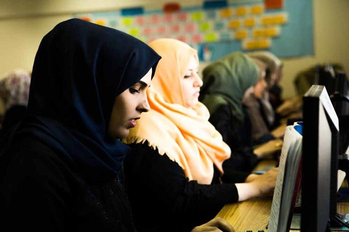 Young women in Gaza working with computers.