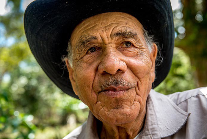 An older Nicaraguan man wearing a cowboy hat.