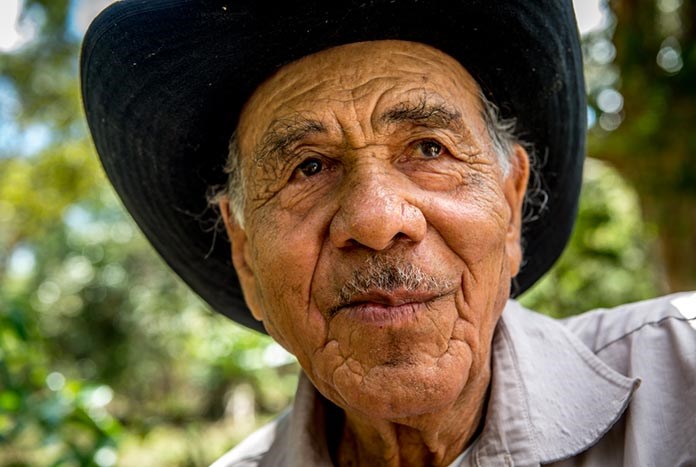 An older Nicaraguan man wearing a cowboy hat.