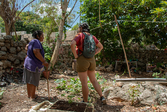 Doña Martha, a woman from the community of Molas in Mexico explaining about the plants in her backyard garden.