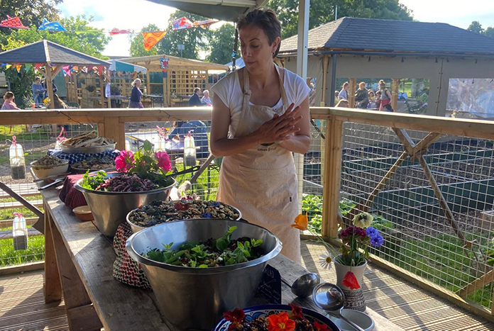 Sally Azzam from Amos Trust cooking at a community event in Bristol — Summer 2024