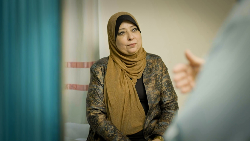 A woman in Gaza meets with her doctor.